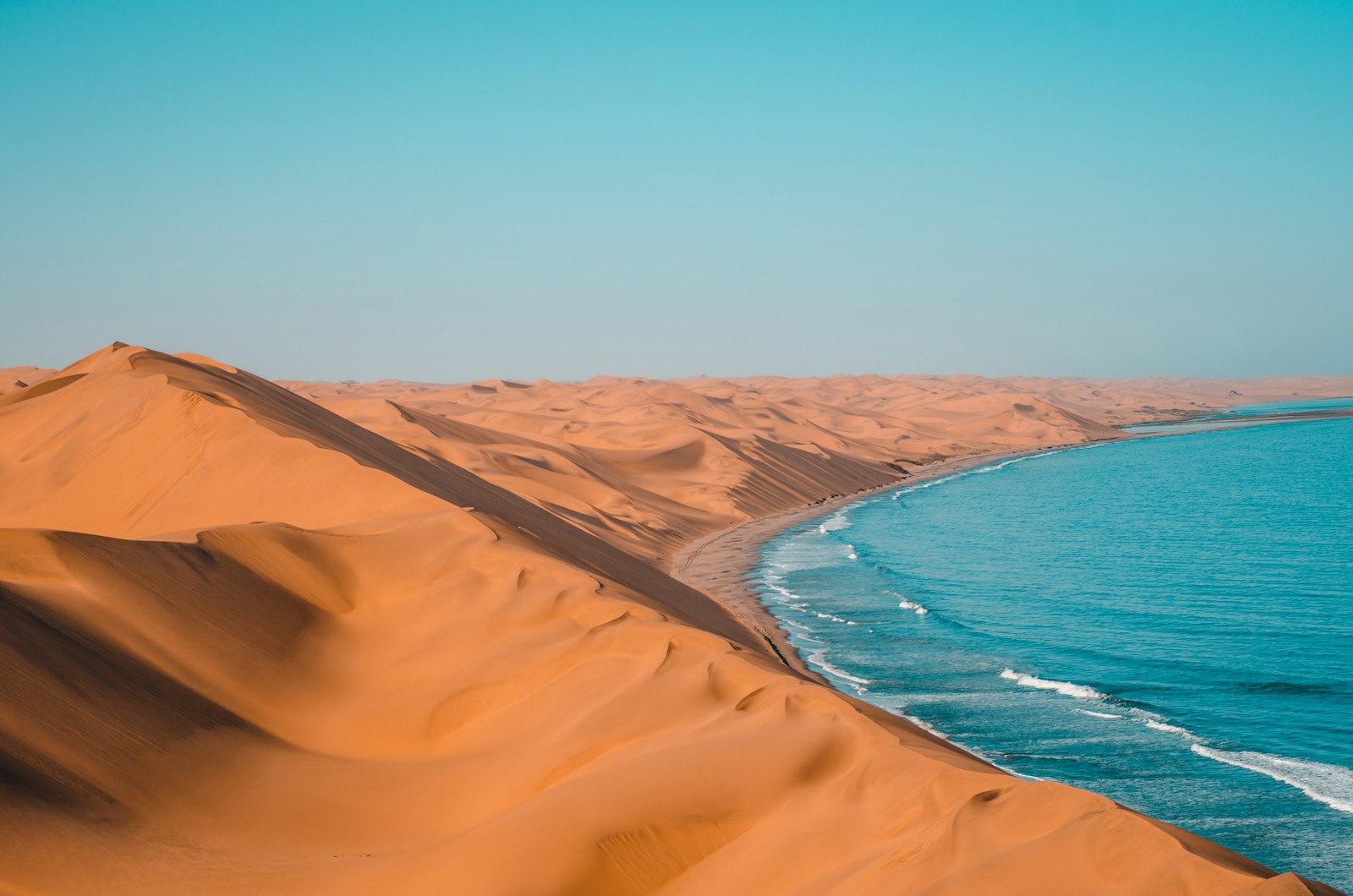 Sand dunes meeting the ocean along the Namibian Skeleton Coast